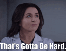 a woman in a lab coat with the words that 's gotta be hard on the bottom