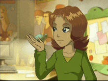 a cartoon girl in a green sweater is waving