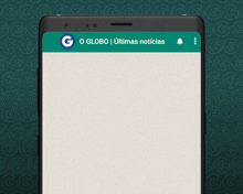a cell phone with a message from o globo on the screen