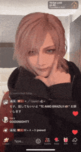 a screenshot of a tiktok live shows a girl with pink hair and blue eyes