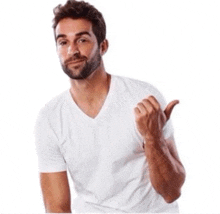 a man with a beard is wearing a white t-shirt and giving a thumbs up sign