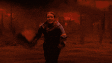 a woman in a hoodie with the word spiderman on it