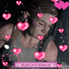 a picture of a girl with pink hearts around her and the words stupid and bisexual on the bottom