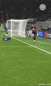 a soccer player celebrates a goal in front of a pepsi sign