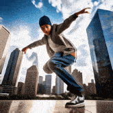 a boy is doing a trick in front of tall buildings