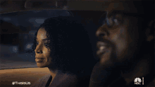 a man and a woman in a car with #thisisus
