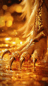 a close up of a person 's foot with a gold colored claw