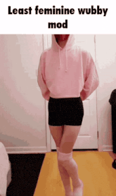 a person wearing a pink hoodie and knee high socks with the words least feminine wubby mod