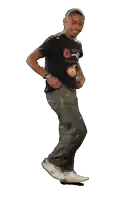 a man wearing a black shirt that says ' a ' on it is walking and smiling