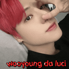 a picture of a person with red hair and the words wooyoung da luci above them