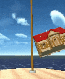 a house with a red roof hanging from a pole