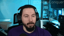 a man wearing headphones and a purple shirt with the words divide aconquer on the bottom right