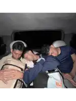 three young men are sleeping in the back seat of a car with a bag that says elj