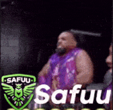 a man in a purple shirt is sitting in a chair with the word safuu on the bottom .
