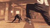 a gif from gifrun.com shows a man being kicked