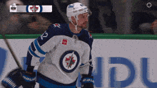 a hockey player wearing a jersey with the number 2 on it