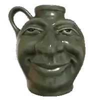 a green vase with a face and a red knife