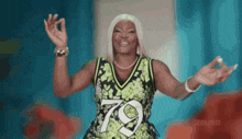 a woman wearing a number 79 jersey is giving a peace sign