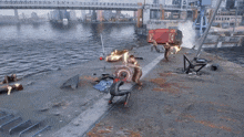 a video game is being played on a dock with a red container that says ' a ' on it