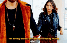 a man and a woman are holding hands and the woman is saying " i 'm already tired of this "