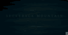 a dark blue background with the words brokeback mountain in white letters