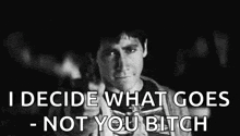 a black and white photo of a person with the words `` i decide what goes - not you bitch '' written on it .