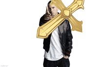 a man in a black jacket holds a gold cross in front of his face