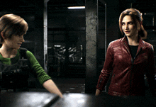 a woman in a red leather jacket talks to another woman in a green shirt