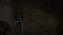 a person is standing in a dark room with a light coming out of it .