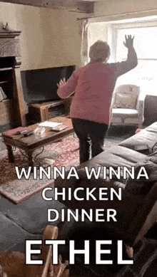 an elderly woman is dancing in a living room with the words winna winna chicken dinner ether .