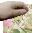 a hand is holding a piece of paper in front of a drawing of a girl .