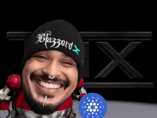 a man wearing a beanie that says blazzard x