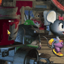 a cartoon mouse with a bow on her head is standing in front of a red box