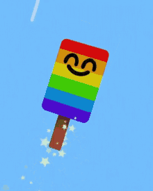 a rainbow colored popsicle with a smiley face on it is flying through the air