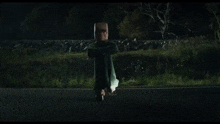 a person is flying through the air in front of a car .
