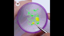 a person is holding a purple container with a brush and painting a yellow flower on it .