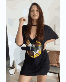 a woman wearing a guns n roses t-shirt dress
