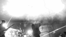 a black and white photo of a band performing