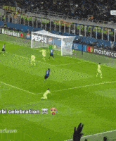 a soccer game is being played on a field with pepsi and mastercard ads