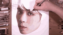 a drawing of a woman 's face is being drawn with a faber castell pen