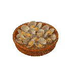 a bowl of clams is sitting on a white surface