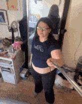 a woman taking a selfie in front of a mirror while wearing a shirt that says dont b