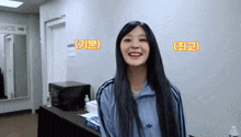a woman wearing a blue adidas jacket is smiling