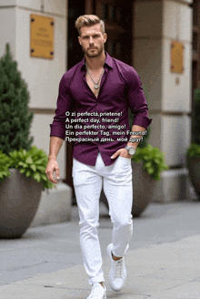 a man wearing a purple shirt and white pants