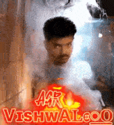 a man is surrounded by smoke and the words acr vishwaloo on the bottom right
