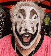 a man with a clown face painted on his face