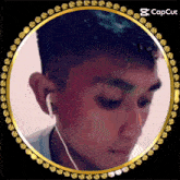 a picture of a man with ear buds in a gold circle with the caption cap cut