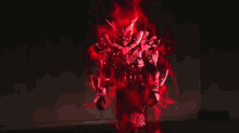 a red light is coming out of a black background