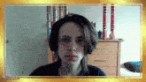 a young man wearing headphones looks at the camera with imgflip.com written below him