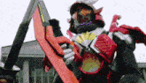 a robot is holding a sword and a fan in his hands .